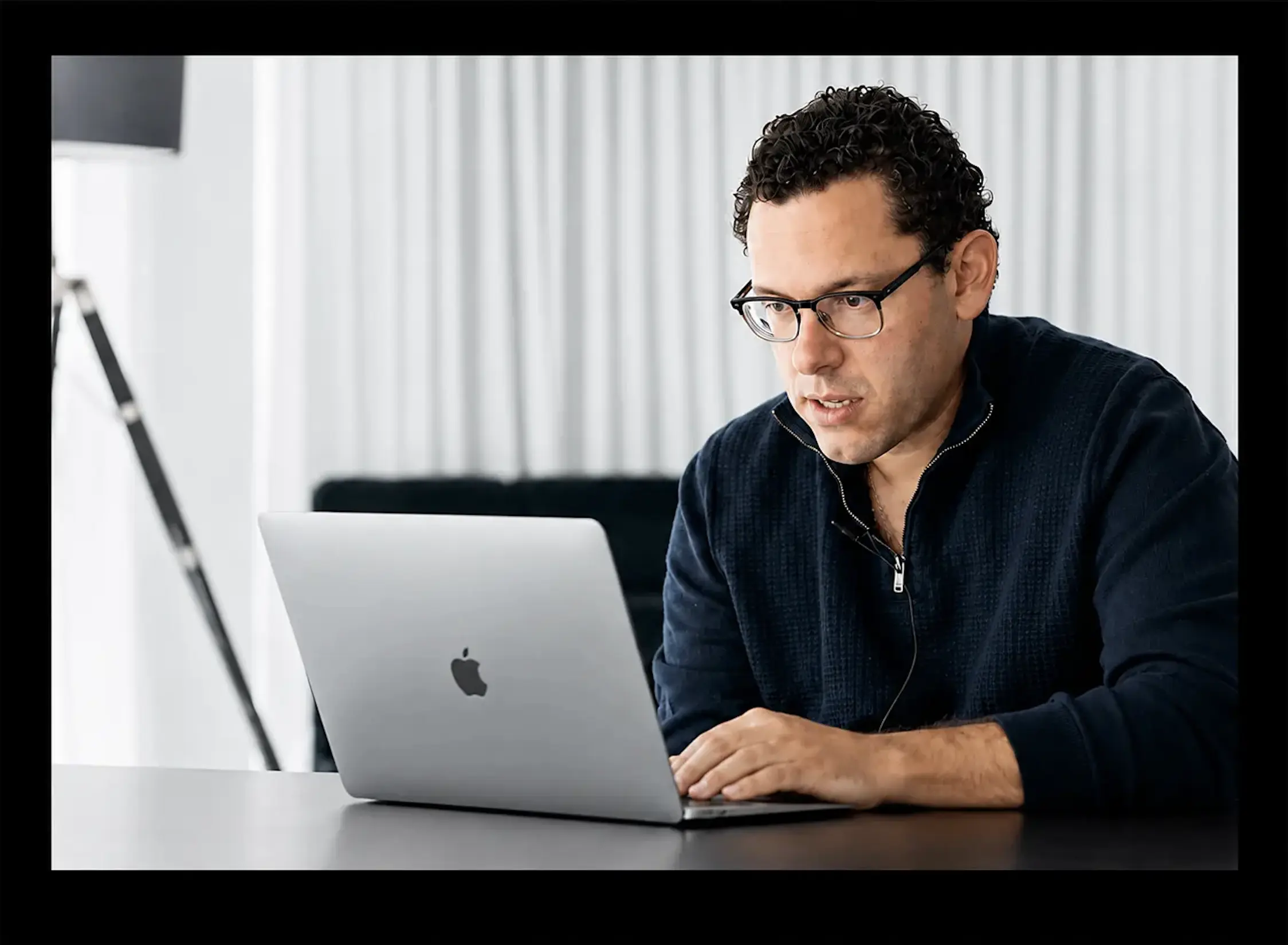 Timothy Sykes looking at computer